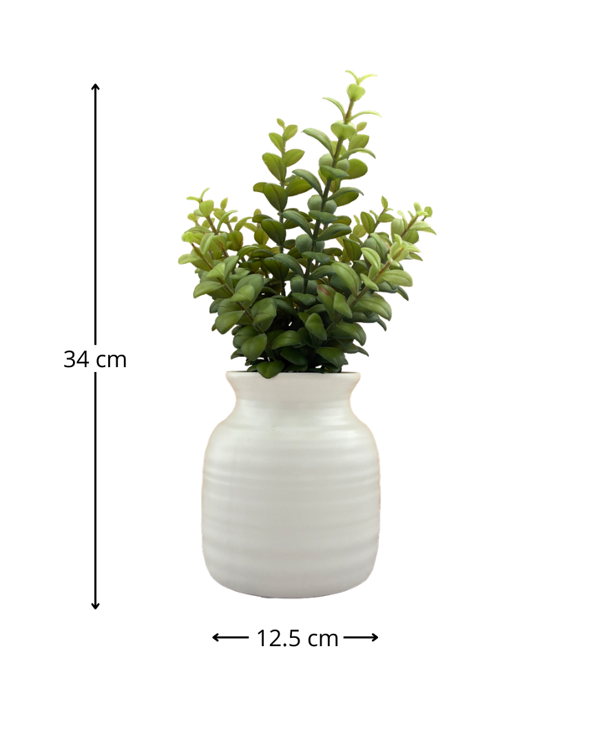 Jarrón de cerámica con planta artificial