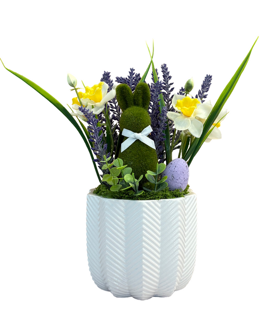 Centro de mesa Conejo Pascua en base de cerámica con follaje artificial