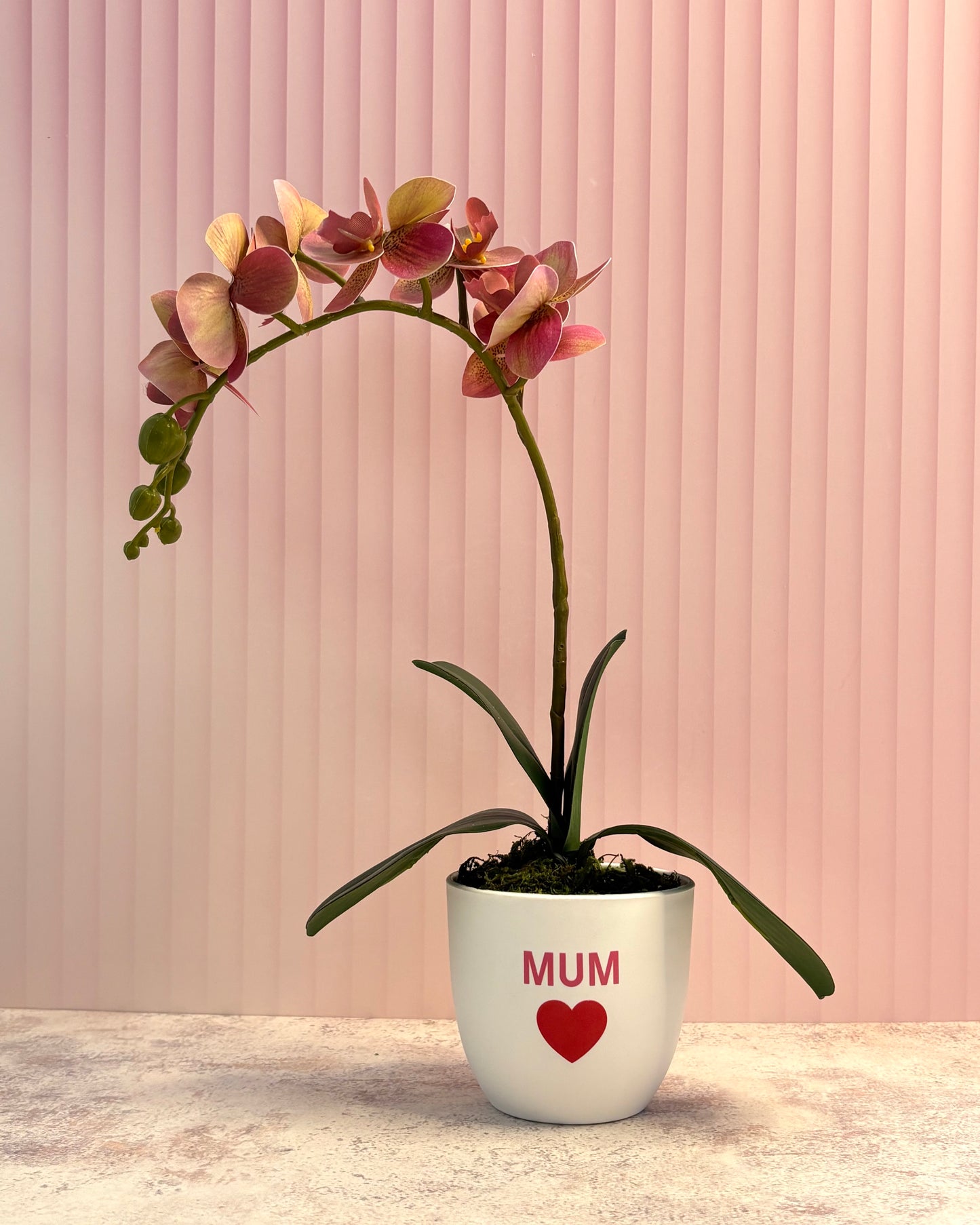 Arreglo orquídea artificial rosa para mamá