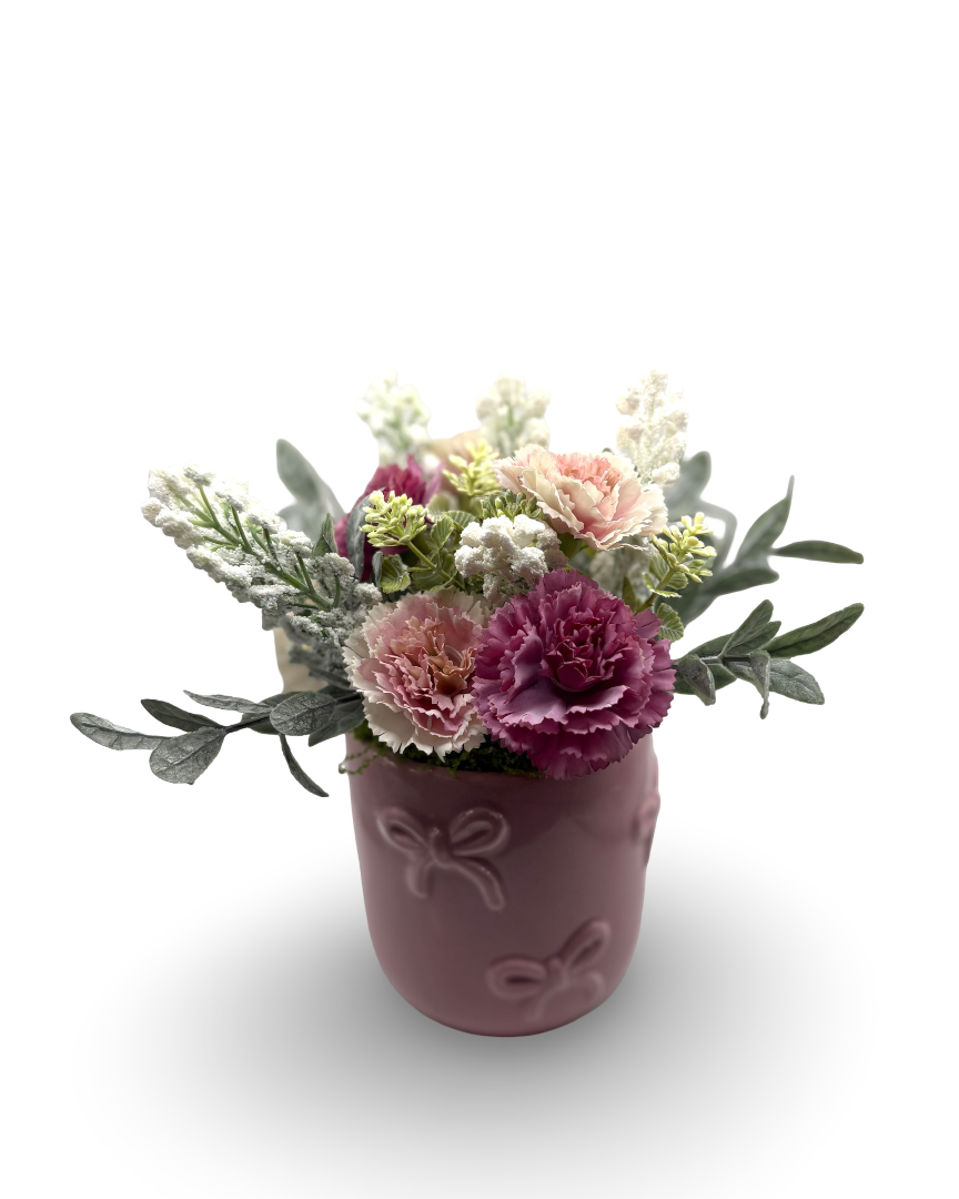 Maceta de cerámica con follaje artificial